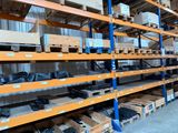 a large rack with many items in it in a warehouse