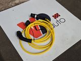 a yellow cable connected to a black and yellow charger on the ground