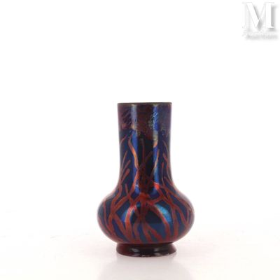 a blue and red vase sitting on a white surface