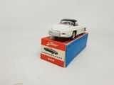 a toy car sitting on top of a box on a table