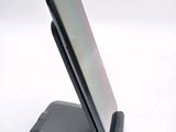 a cell phone that is sitting on top of a stand