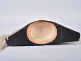 an image of a black hat with a feather on top of it