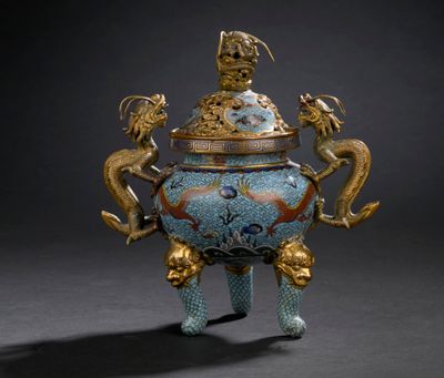 a blue and gold vase with a dragon on it