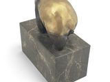 statue of a bear on a marble block on a white background