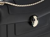 a close up of a black bag with a skull on the front