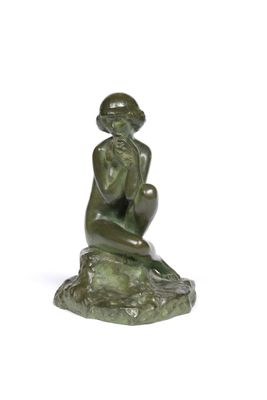statue of a woman sitting on a rock on a white background