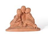 figurine of a woman and two children on a rock