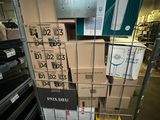 many boxes of electronic equipment in a metal rack