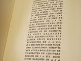 an open book with writing on it sitting on a table