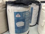 several rolls of toilet paper are stacked on a shelf in a store