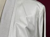 a close up of a white jacket on a mannequin mannequin