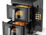 an image of a black air fryer with french fries in it