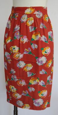 an image of a red skirt with flowers on it on a mannequin