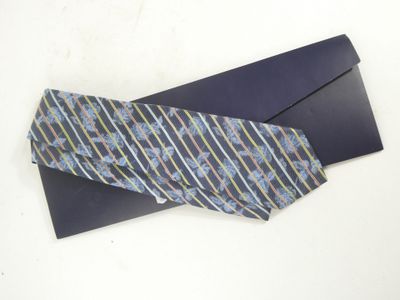 a tie that is laying on top of an envelope