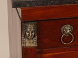 an image of a wooden chest of drawers with a door handle