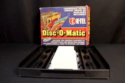 a box of dice - u - matic on a black table