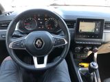 a picture of a man driving a car with a steering wheel