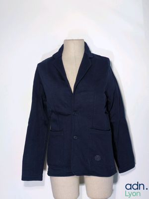 a blue jacket on a mannequin dummy