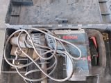 a tool box with tools in it sitting on the floor