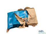 some brown and blue bags are sitting on top of each other