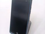a cell phone that is sitting on top of a stand