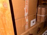 many boxes stacked on top of each other in a warehouse