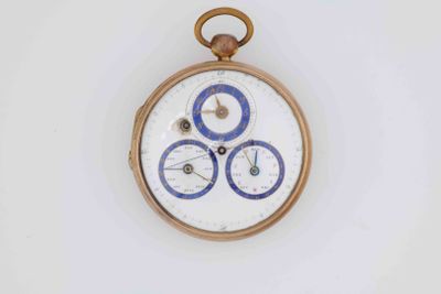 a small pocket watch that has a blue and white design on it