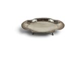 a silver plate on a stand on a white background