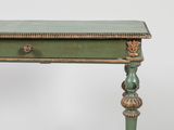 an image of a green table with a drawer underneath it