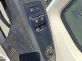 a close up of a car door with a remote control