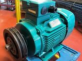 an image of a blue electric motor in a factory