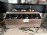 an image of a stove with three burners on top of it