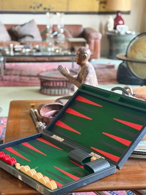 a suitcase with a backgam board on a table