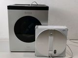 an image of a white and black washing machine and a black and white box
