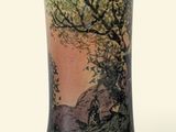 a vase that has a picture of a tree on it
