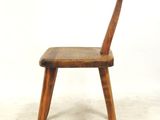 an image of a wooden chair with a bent back and a bent seat