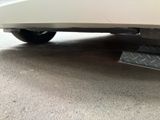 a close up of a car ' s bumper with a diamond plate under the bumper
