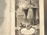 an old book with a picture of a woman holding a staff