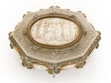 an antique silver box with a picture of a man and a woman on it
