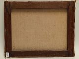 an old picture frame with a piece of wood sticking out of it
