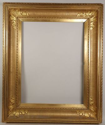 a gold framed mirror with a white background
