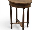une table ronde avec un plateau et des pieds en bois