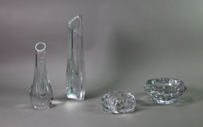several pieces of glass sitting on a table next to each other