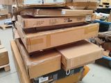 many boxes stacked on top of each other in a warehouse