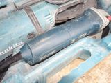 an image of a drill and other tools in a box