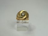 an image of a gold ring with a diamond in the center