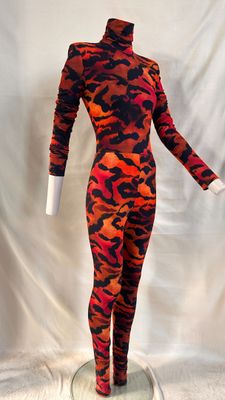 a mannequin wearing a red and black camouflage print bodysuit