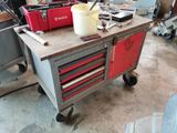 a workbench with tools on top of it in a garage
