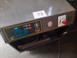 a machine that is sitting on the floor in the room