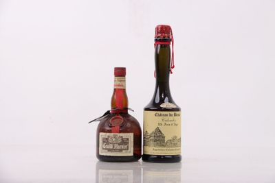 two bottles of wine sitting next to each other on a table